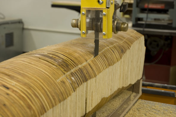 ripping the trunk of the plywood tree on a big ol' banddsaw